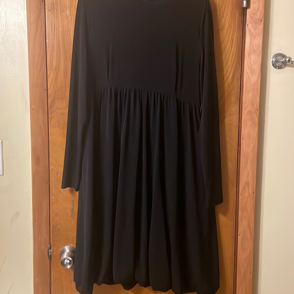 Black dress buttons up and the back